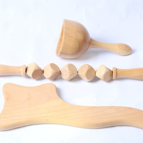AUREKO contour body board shown with coordinating natural wood massage tools